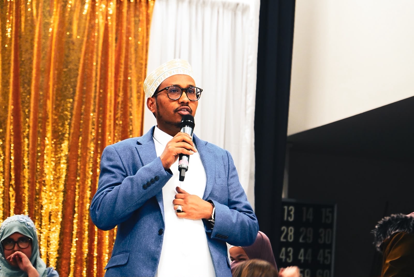 An Al-Taqwa Academy speaker addressing families at a school event
